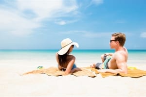 Photo of a Couple on the Beach. Beach Relaxation is One of the Many Romantic Things to Do in Myrtle Beach.