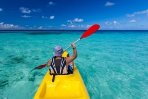 Photo of a Man Paddling in the Atlantic Using One of the Sturdiest Myrtle Beach Kayak Rentals.