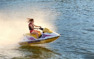 Photo of a Woman Cruising on a Jet Ski Rental in Myrtle Beach.